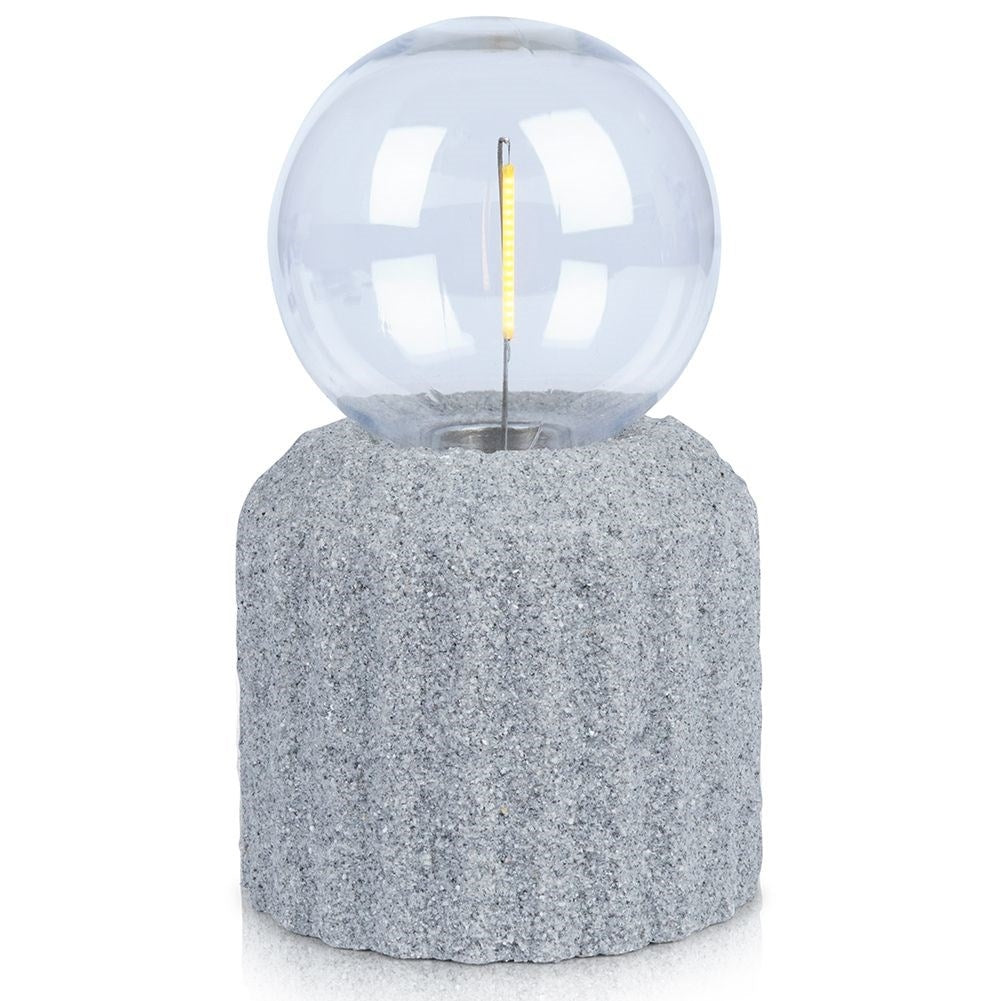 Battery-powered LED table lamp with a cement-like base
