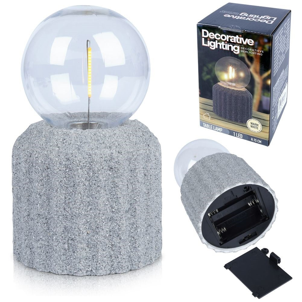 Battery-powered LED table lamp with a cement-like base