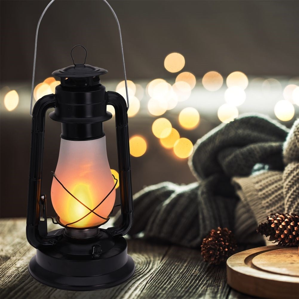 Battery-powered lantern with moving flame for home and garden