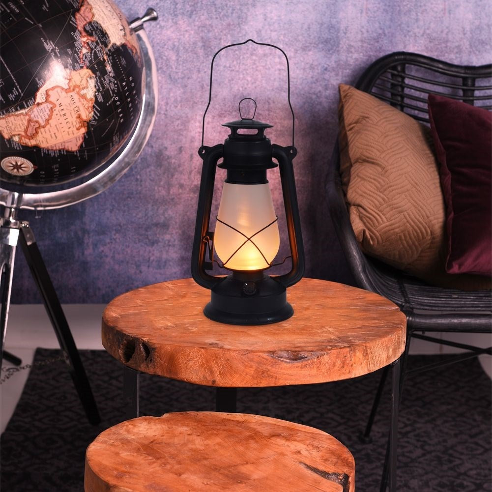 Battery-powered lantern with moving flame for home and garden