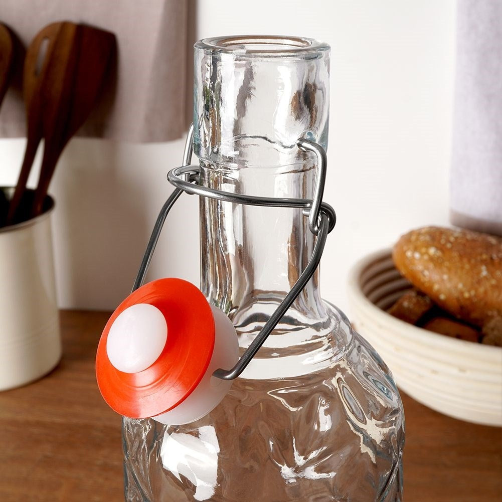 Beautiful glass bottle with cork and clamp for drinks