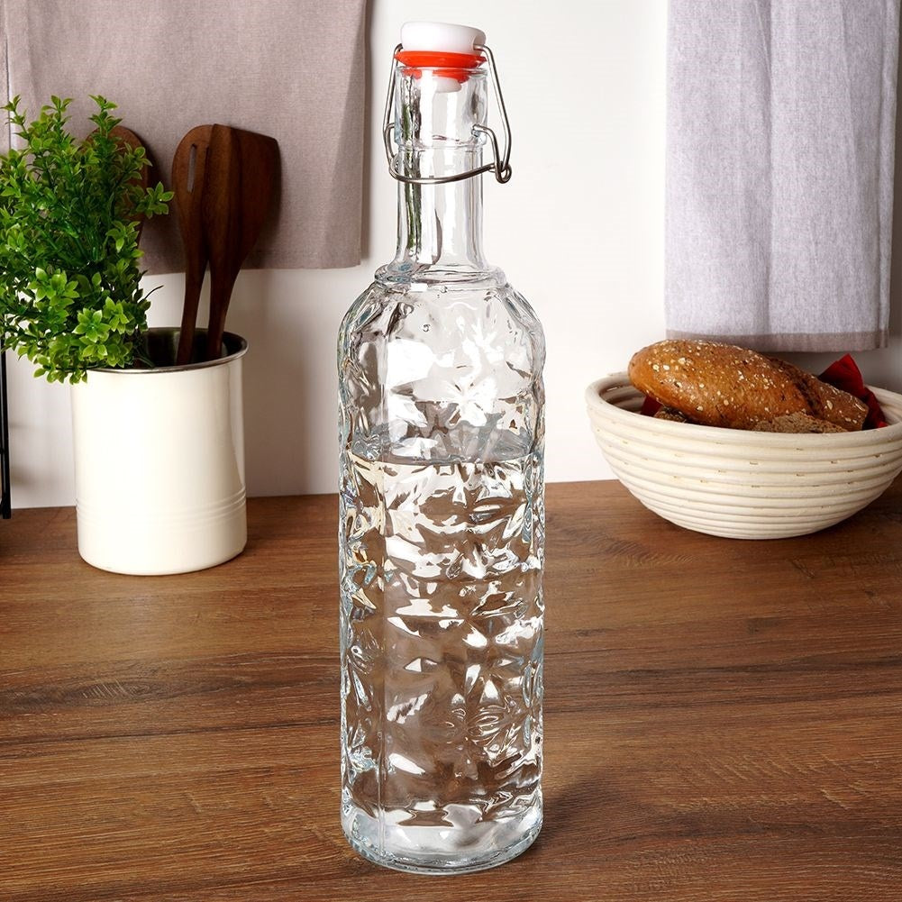 Beautiful glass bottle with cork and clamp for drinks