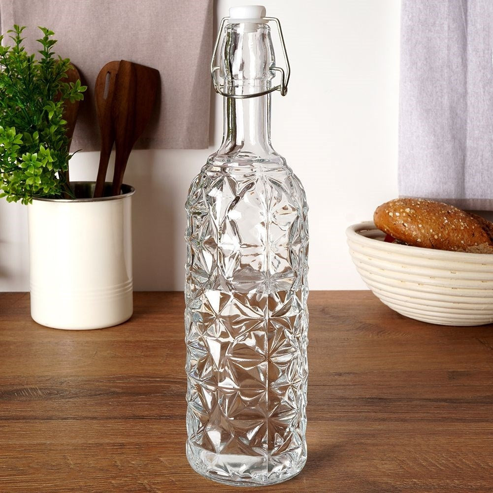 Beautiful glass bottle with cork and clamp for drinks