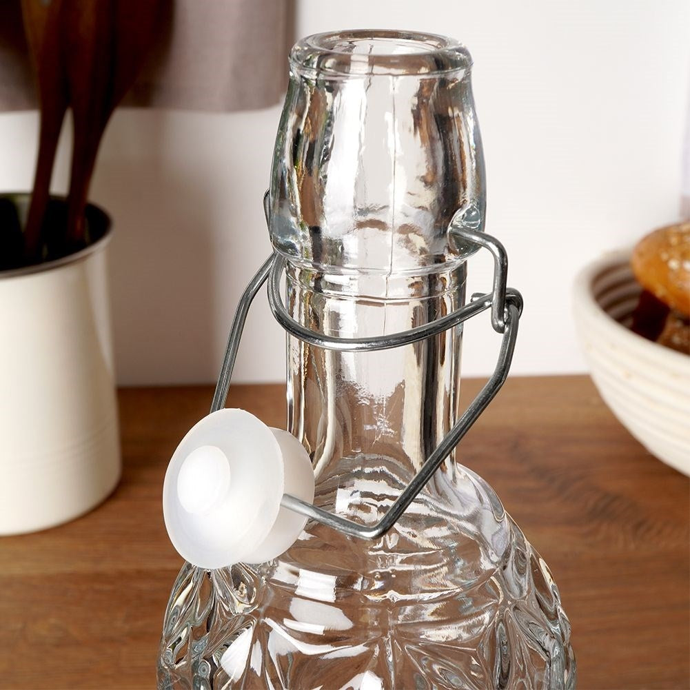 Beautiful glass bottle with cork and clamp for drinks