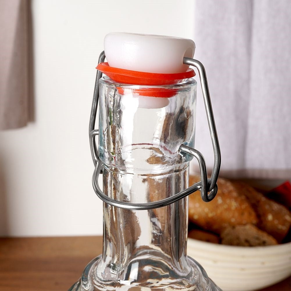 Beautiful glass bottle with cork and clamp for drinks