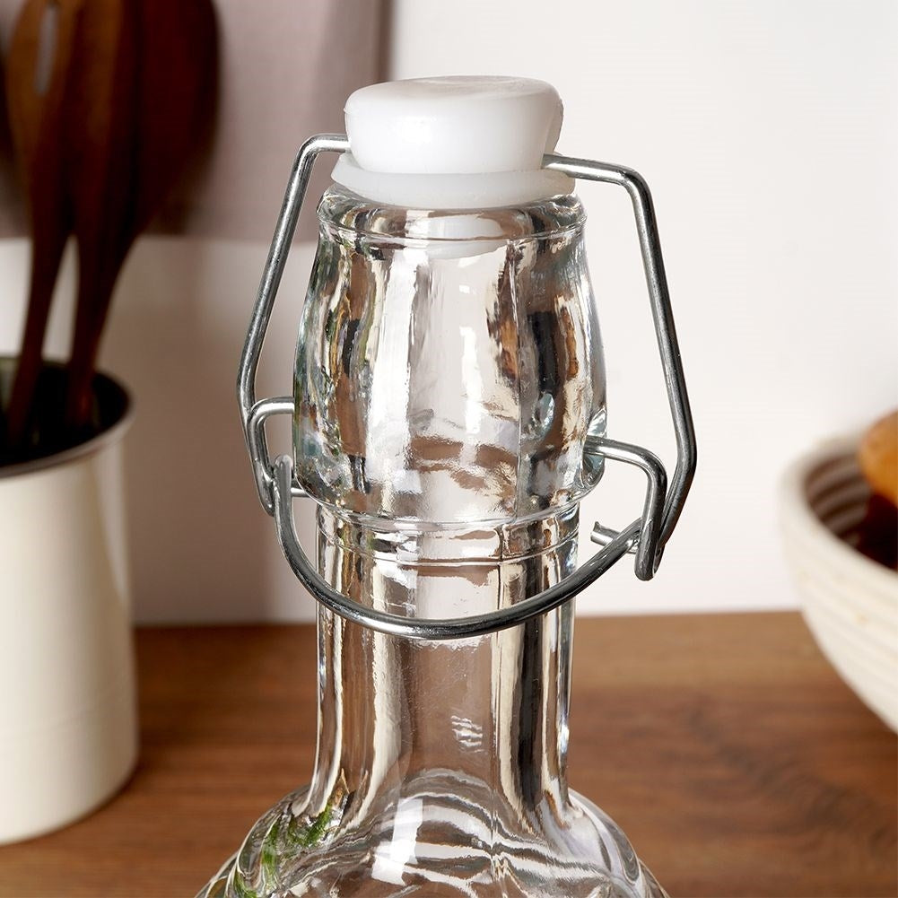 Beautiful glass bottle with cork and clamp for drinks
