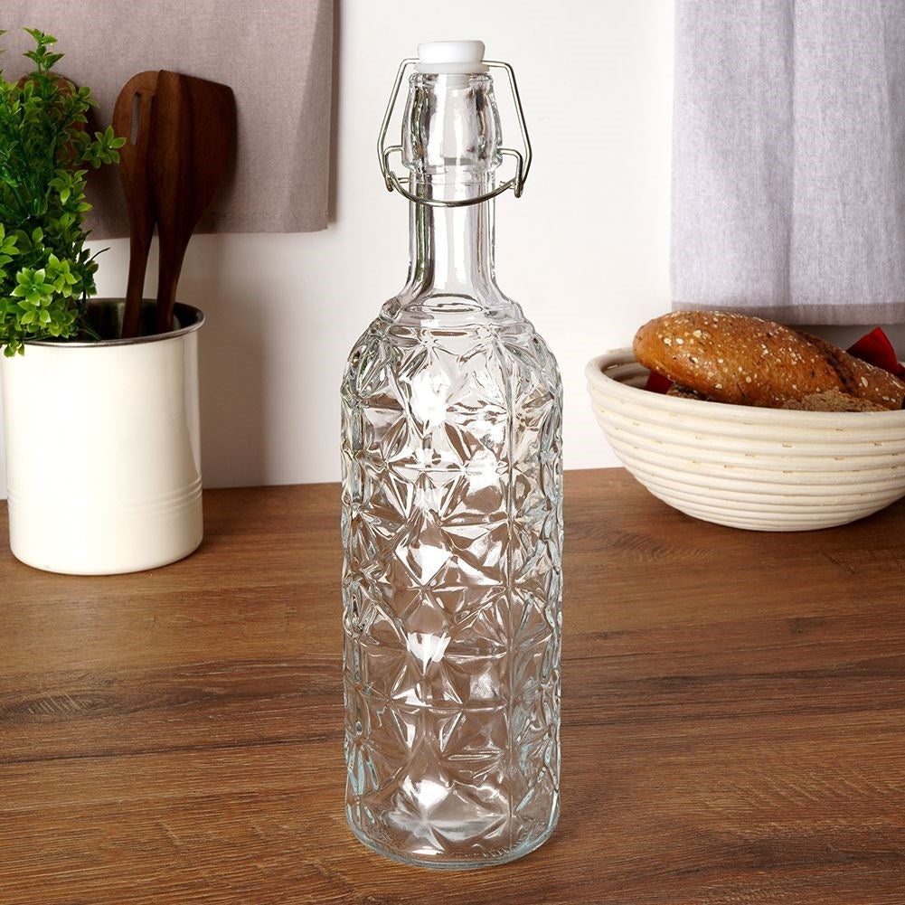 Beautiful glass bottle with cork and clamp for drinks