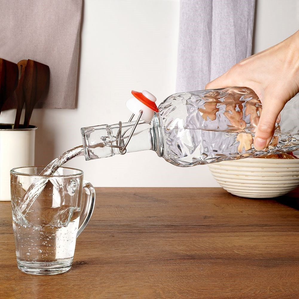 Beautiful glass bottle with cork and clamp for drinks