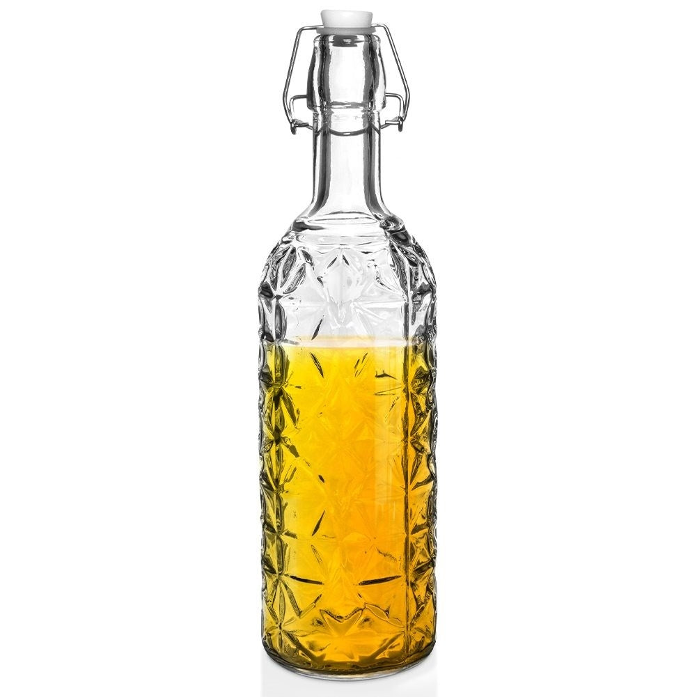 Beautiful glass bottle with cork and clamp for drinks