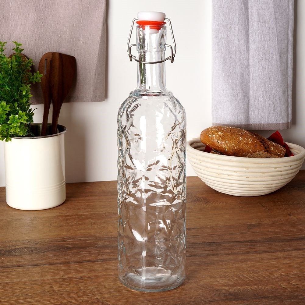Beautiful glass bottle with cork and clamp for drinks