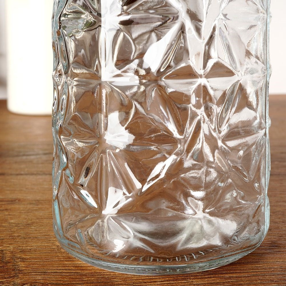 Beautiful glass bottle with cork and clamp for drinks