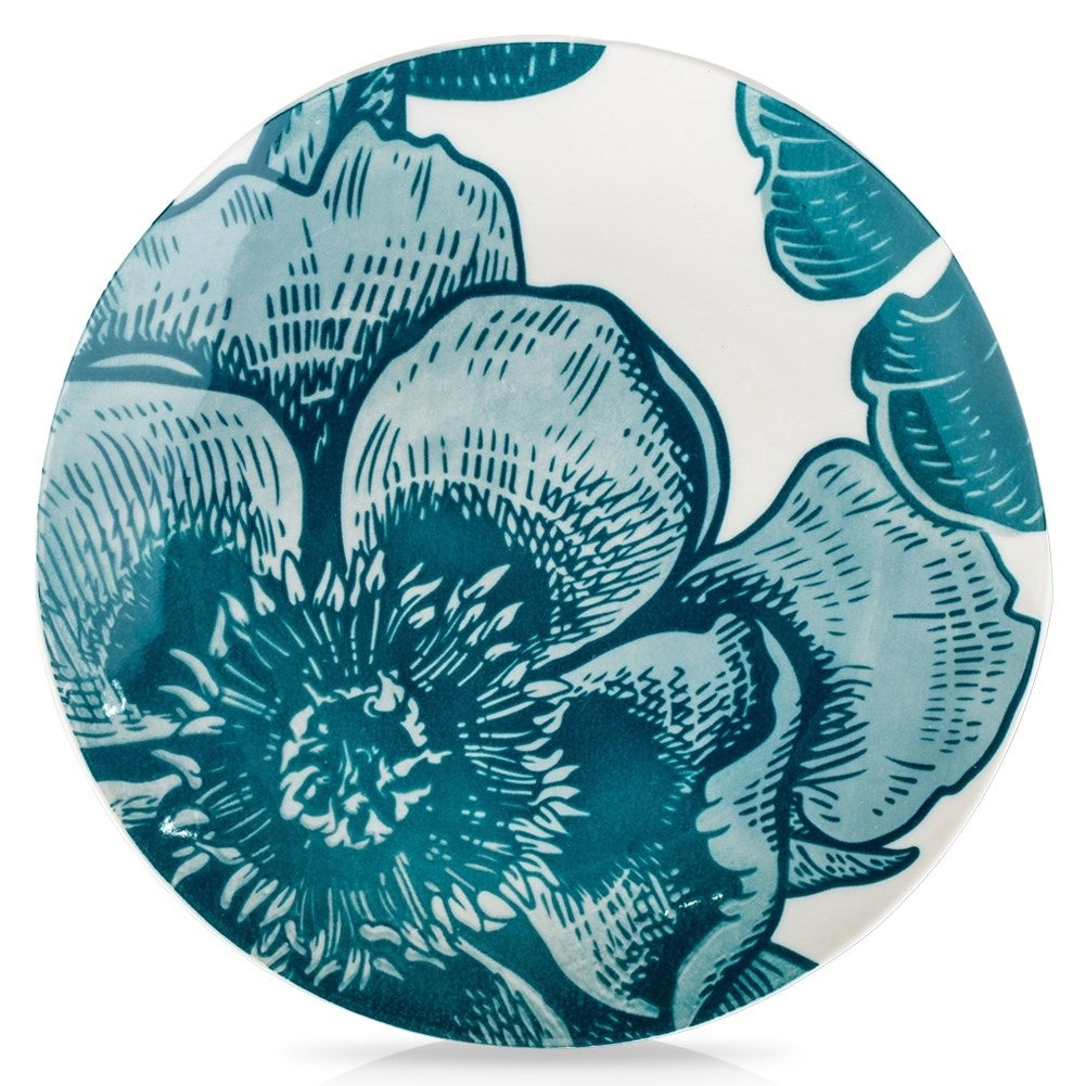Beautiful white porcelain dish with turquoise floral motifs for desserts