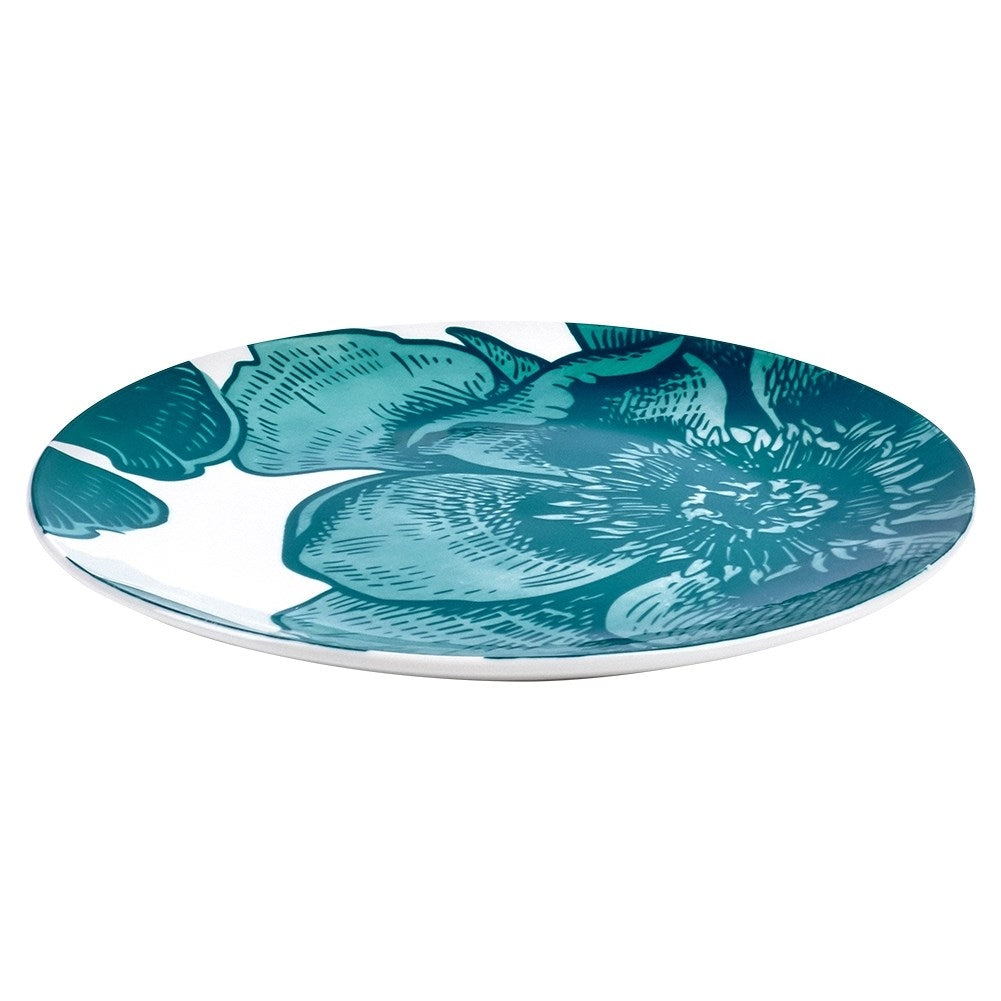 Beautiful white porcelain dish with turquoise floral motifs for desserts