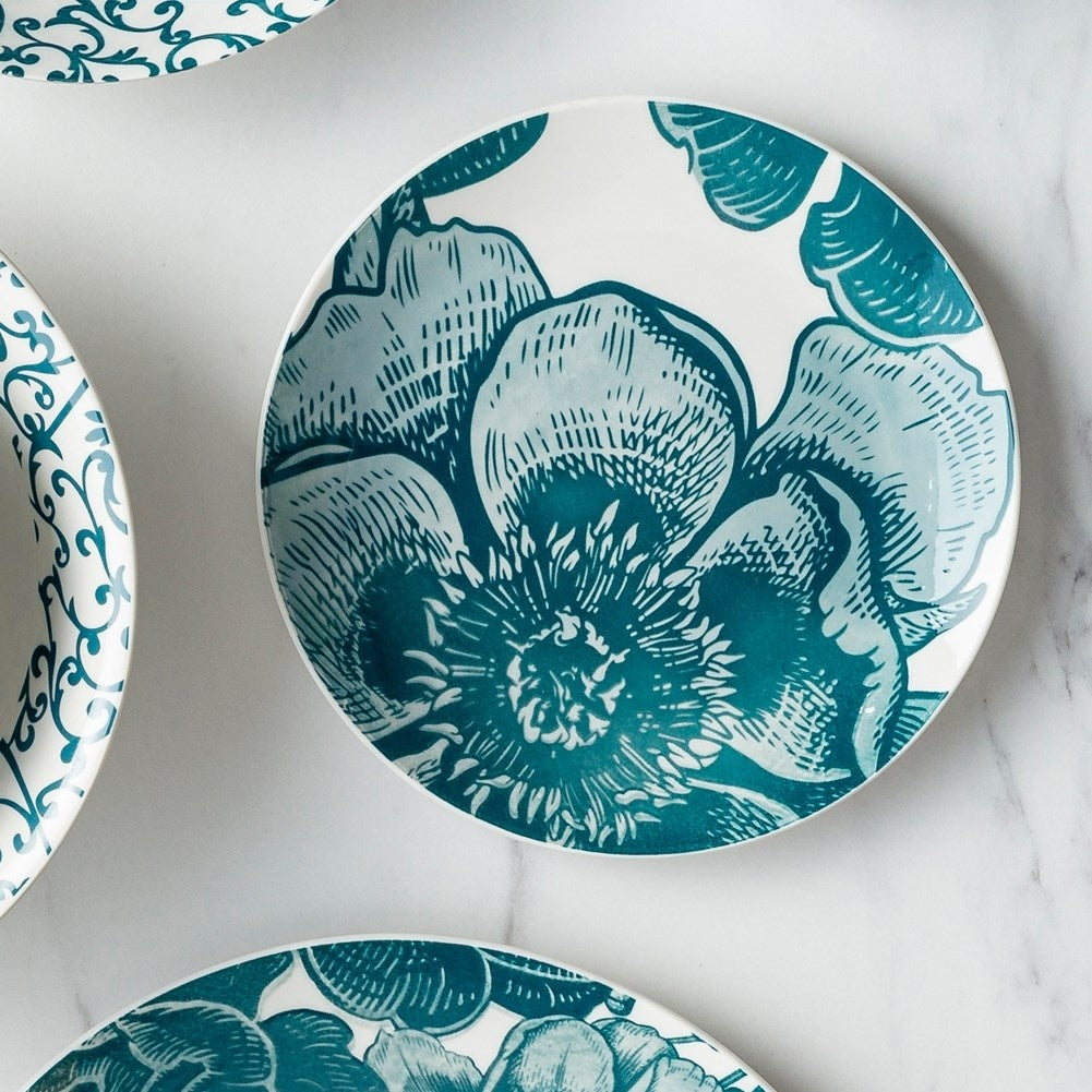 Beautiful white porcelain dish with turquoise floral motifs for desserts