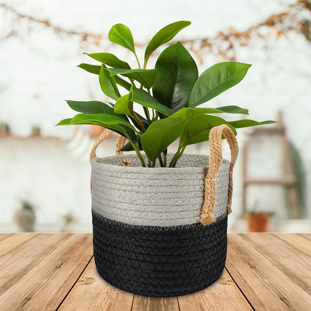 Black and gray waste bin with handle for storage