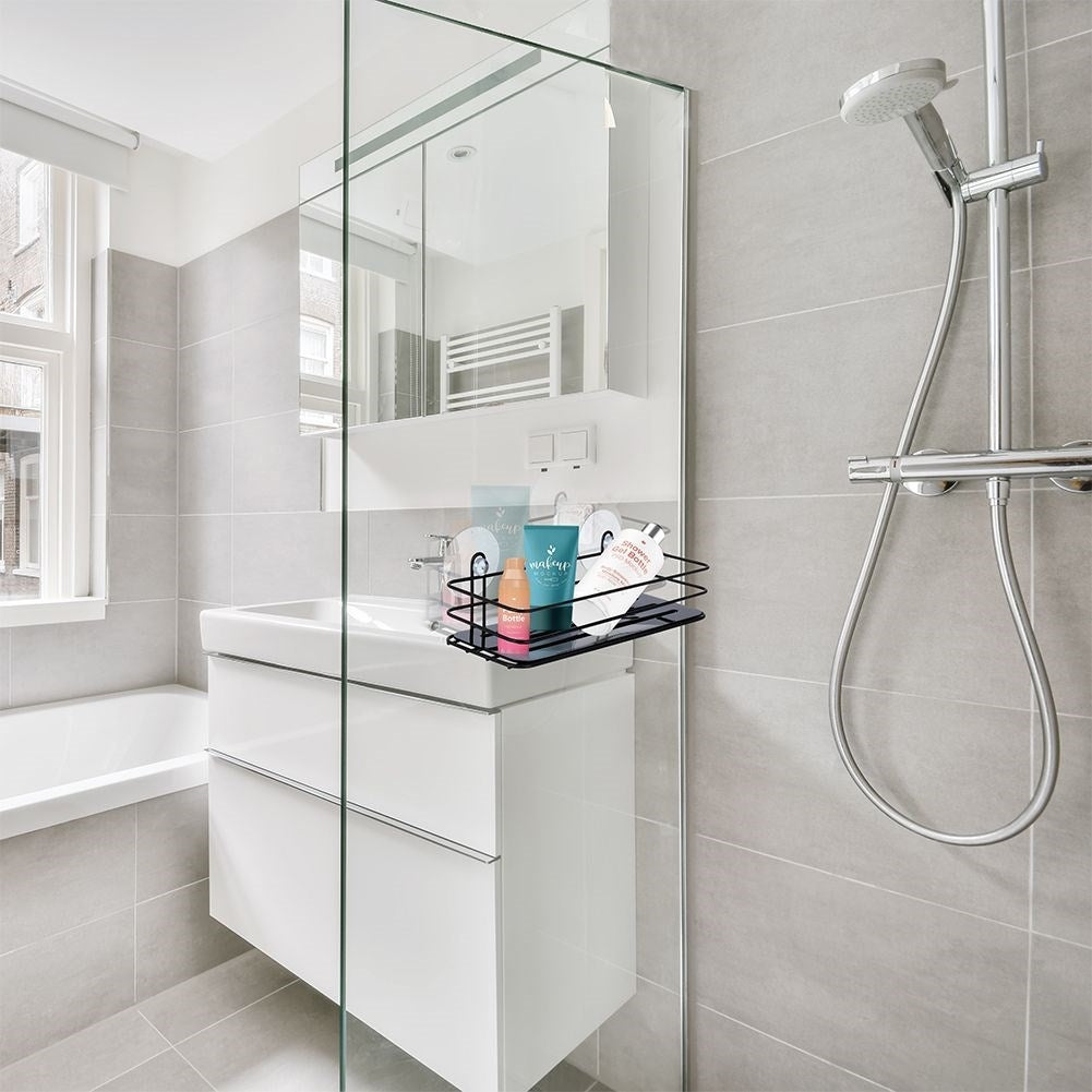 Black bathroom shelf with suction cups for cosmetics and accessories