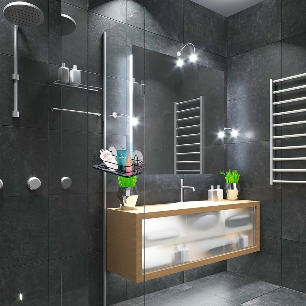 Black bathroom shelf with suction cups for cosmetics and accessories