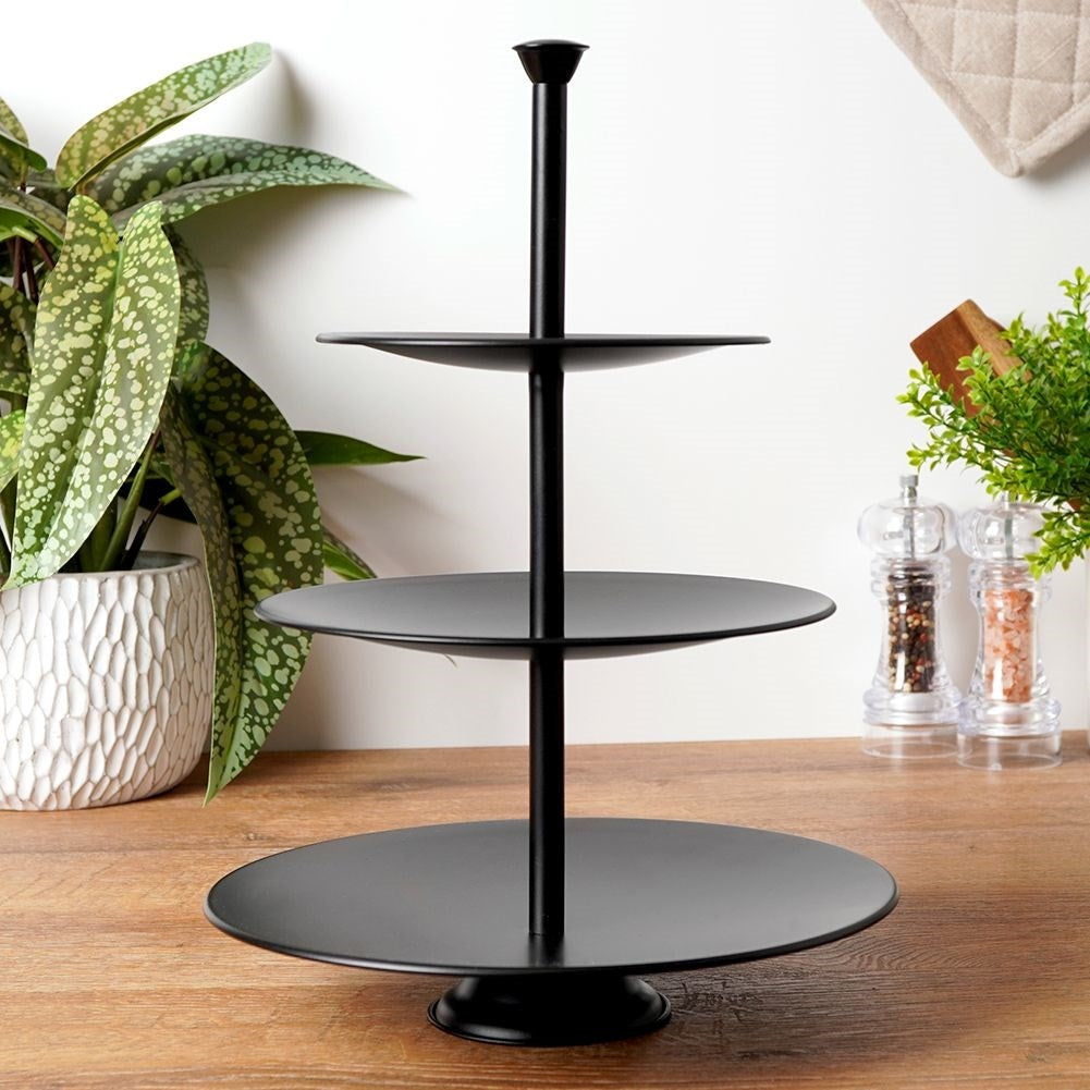 Black cake plate with three levels for muffins and desserts