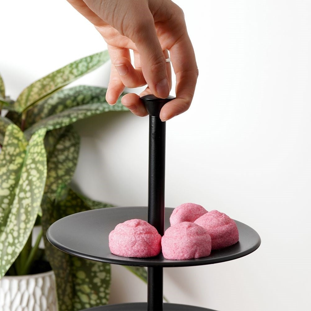 Black cake plate with three levels for muffins and desserts