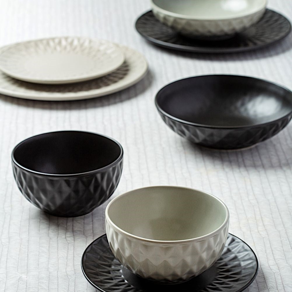 Black ceramic dessert plate with decorative pattern