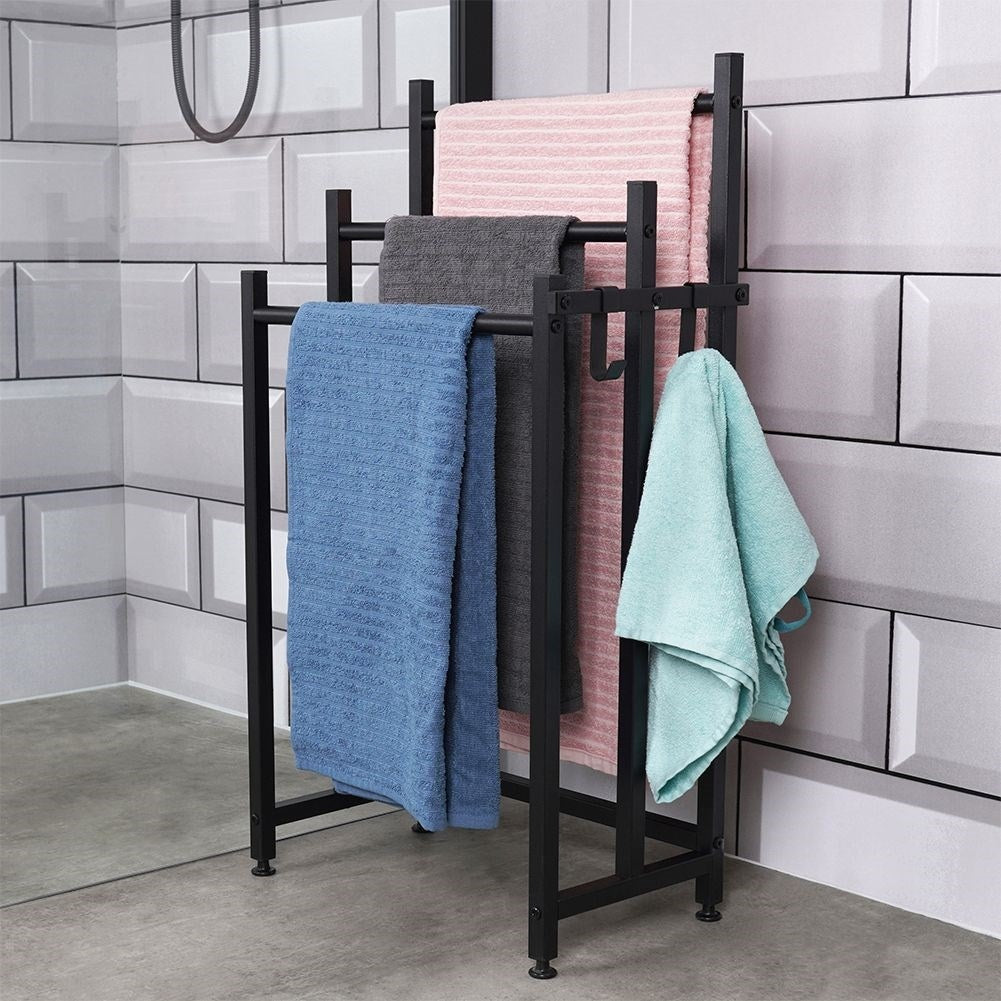 Black, free-standing towel rail with 3 bars and 2 hooks