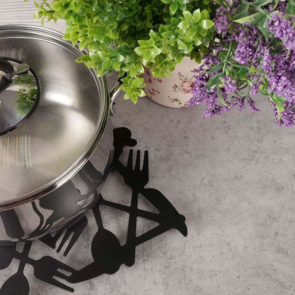 Black metal coaster for hot dishes with a stylish design
