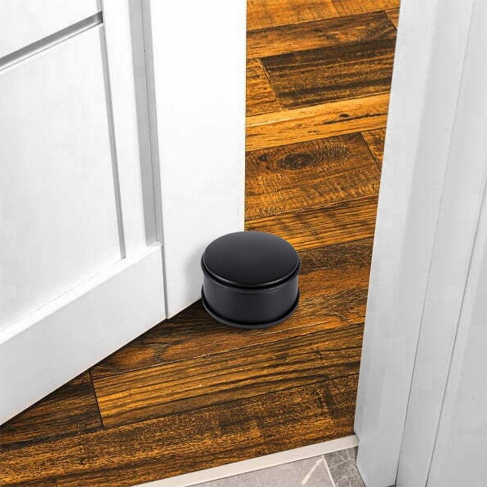 Black metal door stop with rubber cover, no assembly