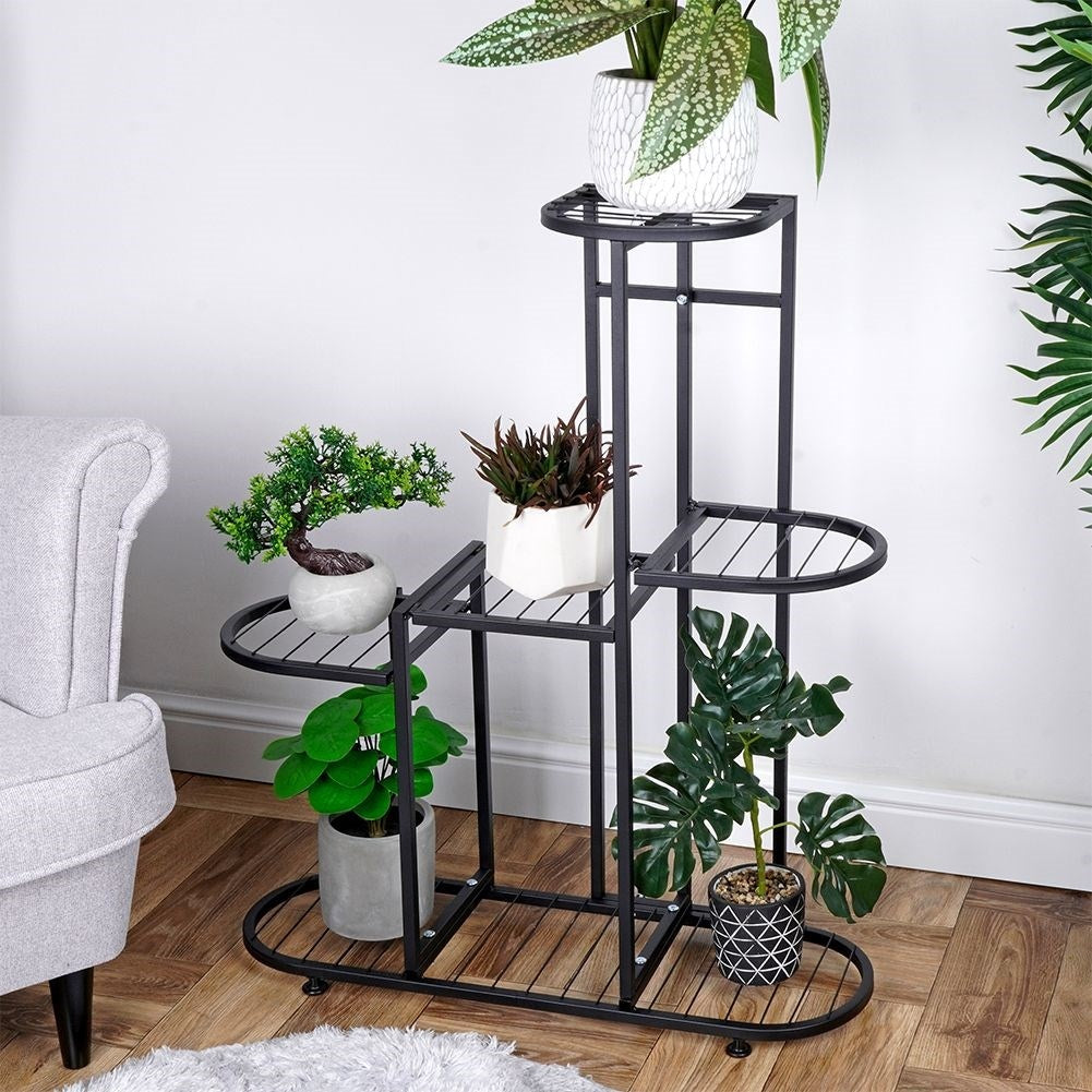 Black metal flower stand with five levels for potted plants