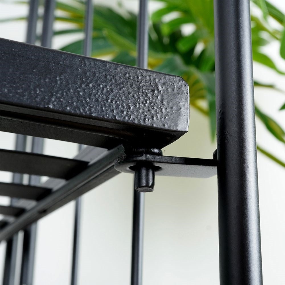 Black metal flower stand with four levels for decorations