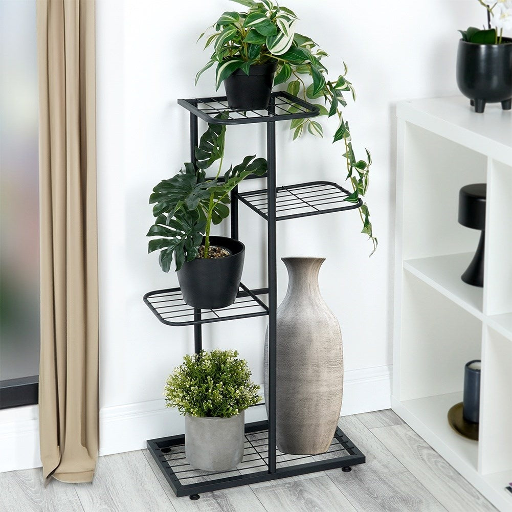 Black metal flower stand with four levels for indoor use