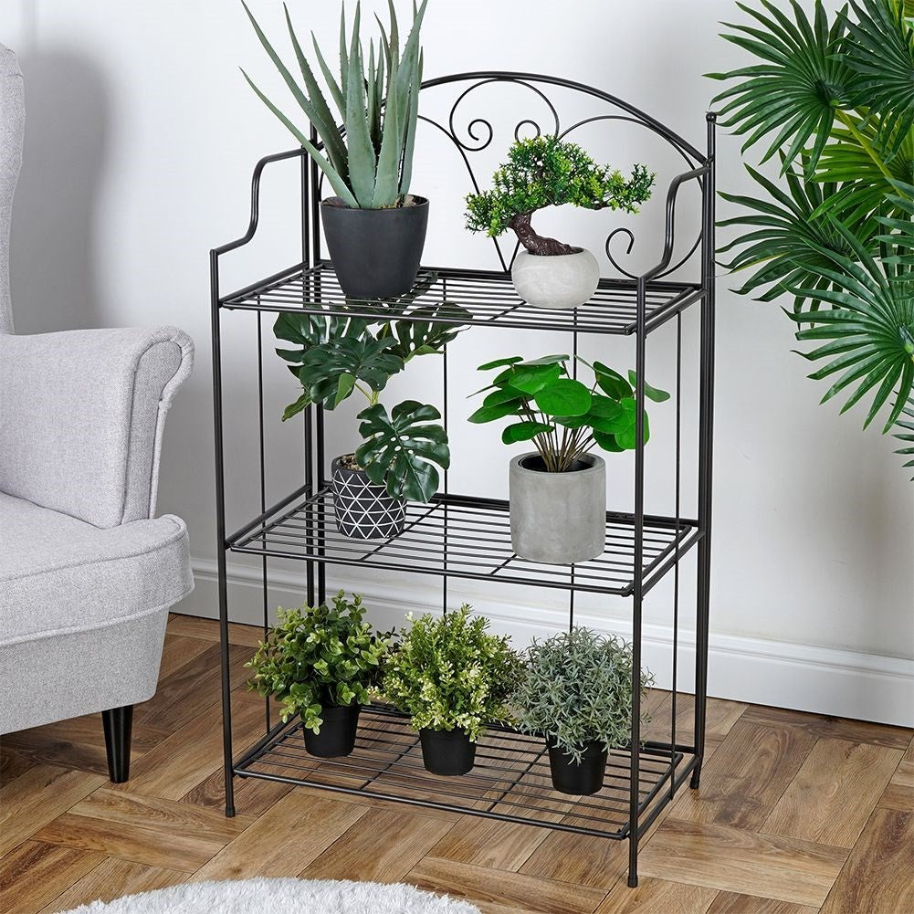 Black metal flower stand with three levels for pots