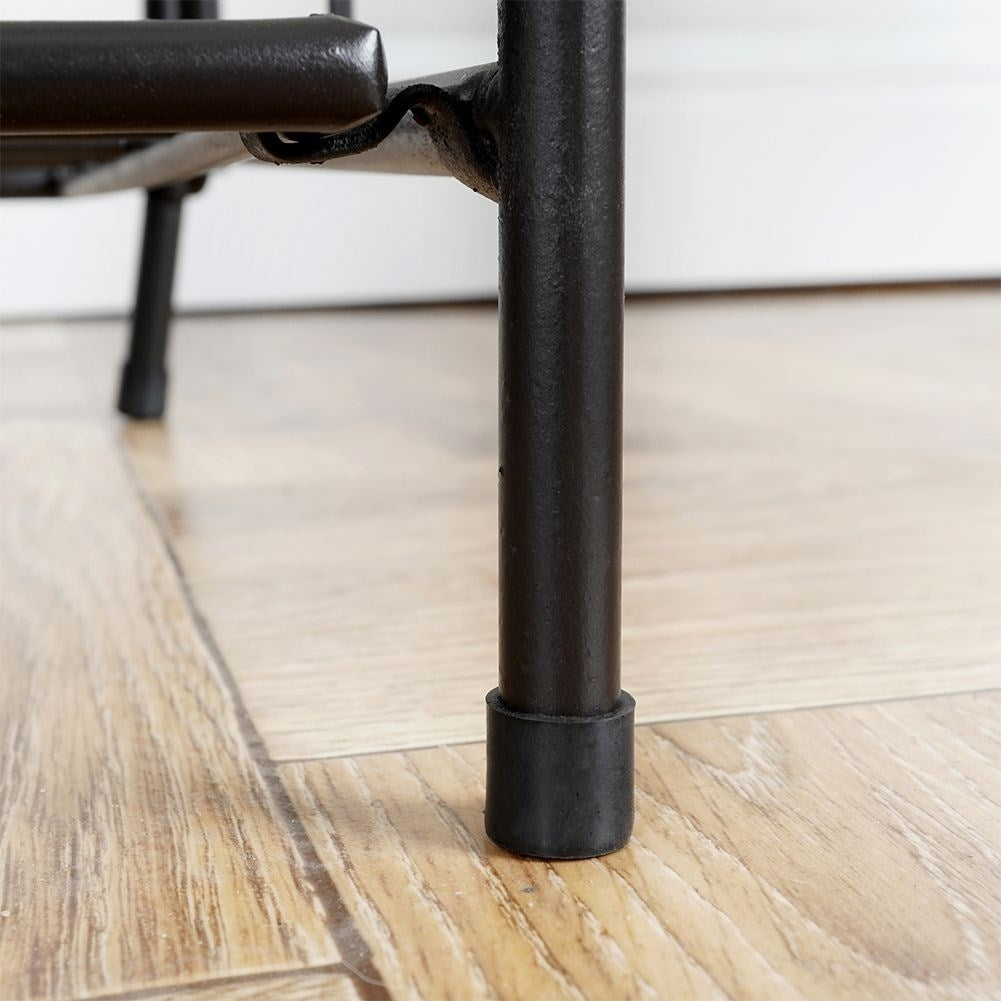 Black metal flower stand with three levels for pots