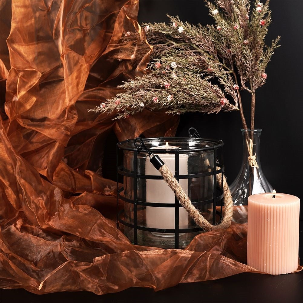 Black metal lantern with glass for home, balcony or terrace