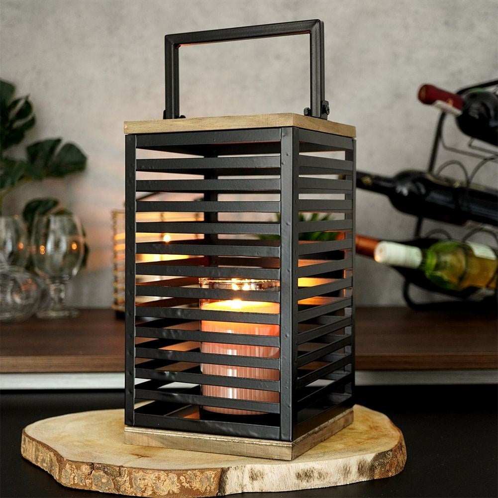 Black metal lantern with large glass insert for outside and inside