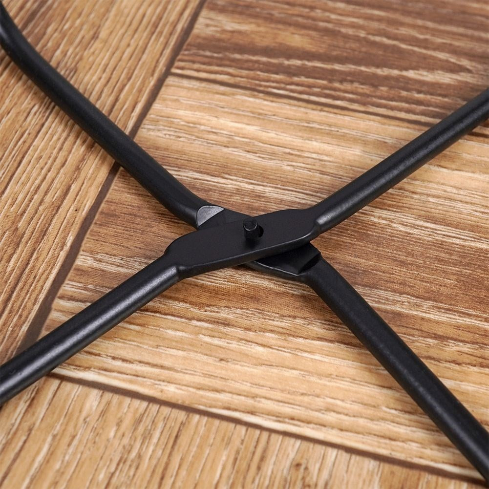 Black metal pot on stand for modern interiors
