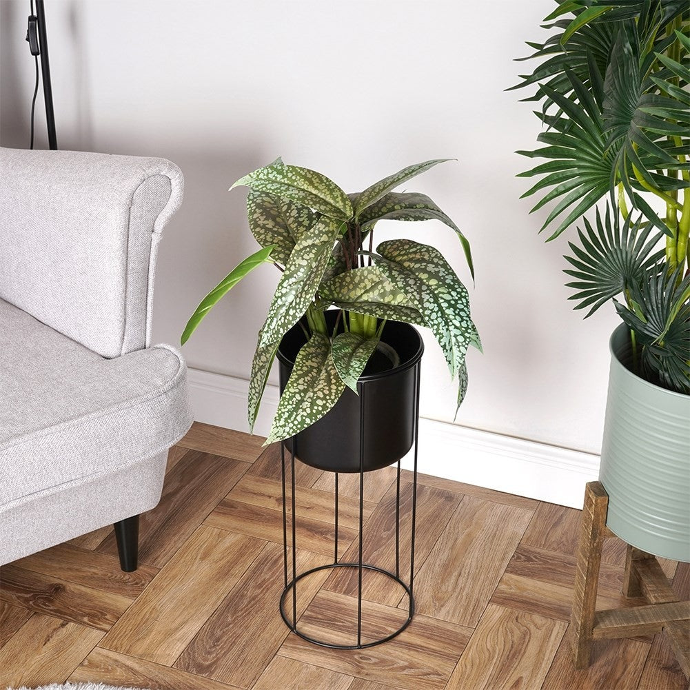 Black metal pot on stand for stylish plant display