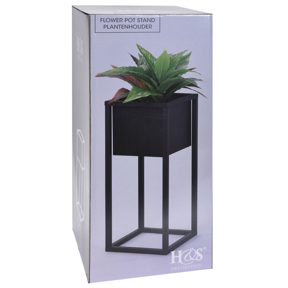 Black metal pot on stand in industrial style