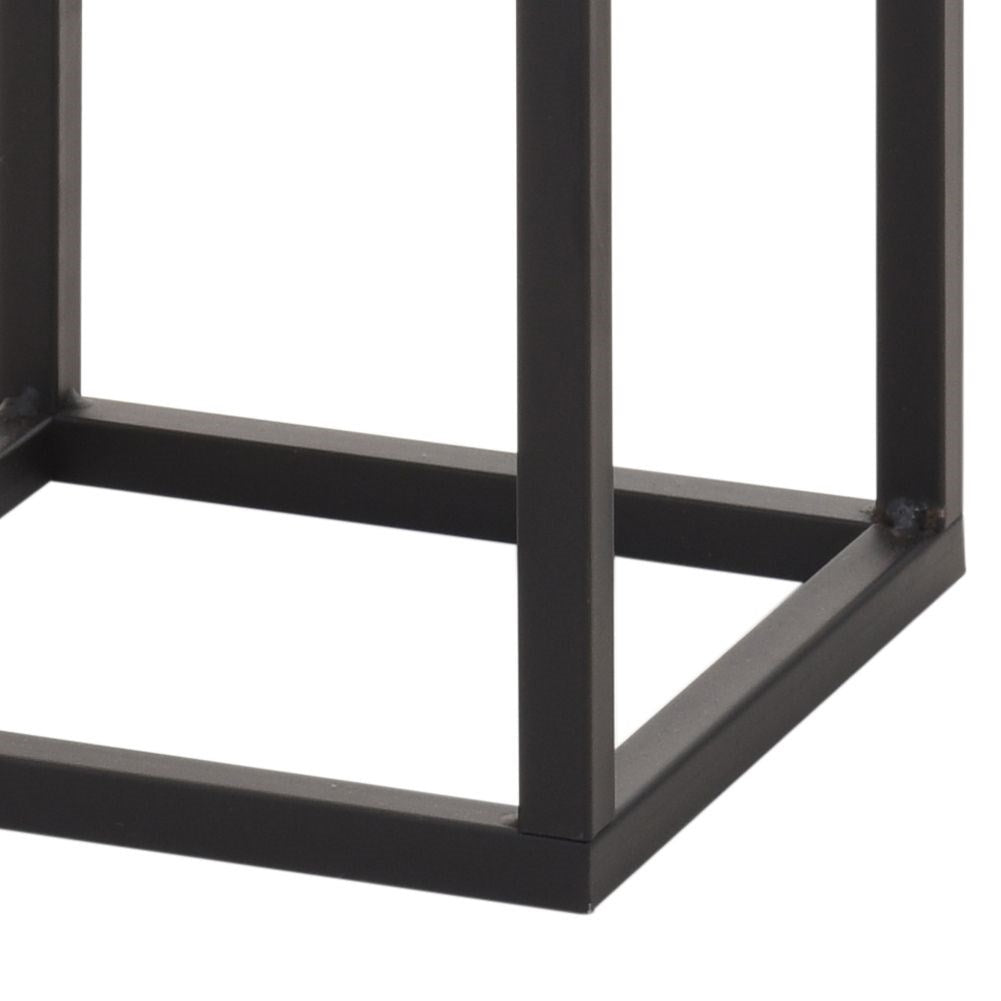 Black metal pot on stand in industrial style
