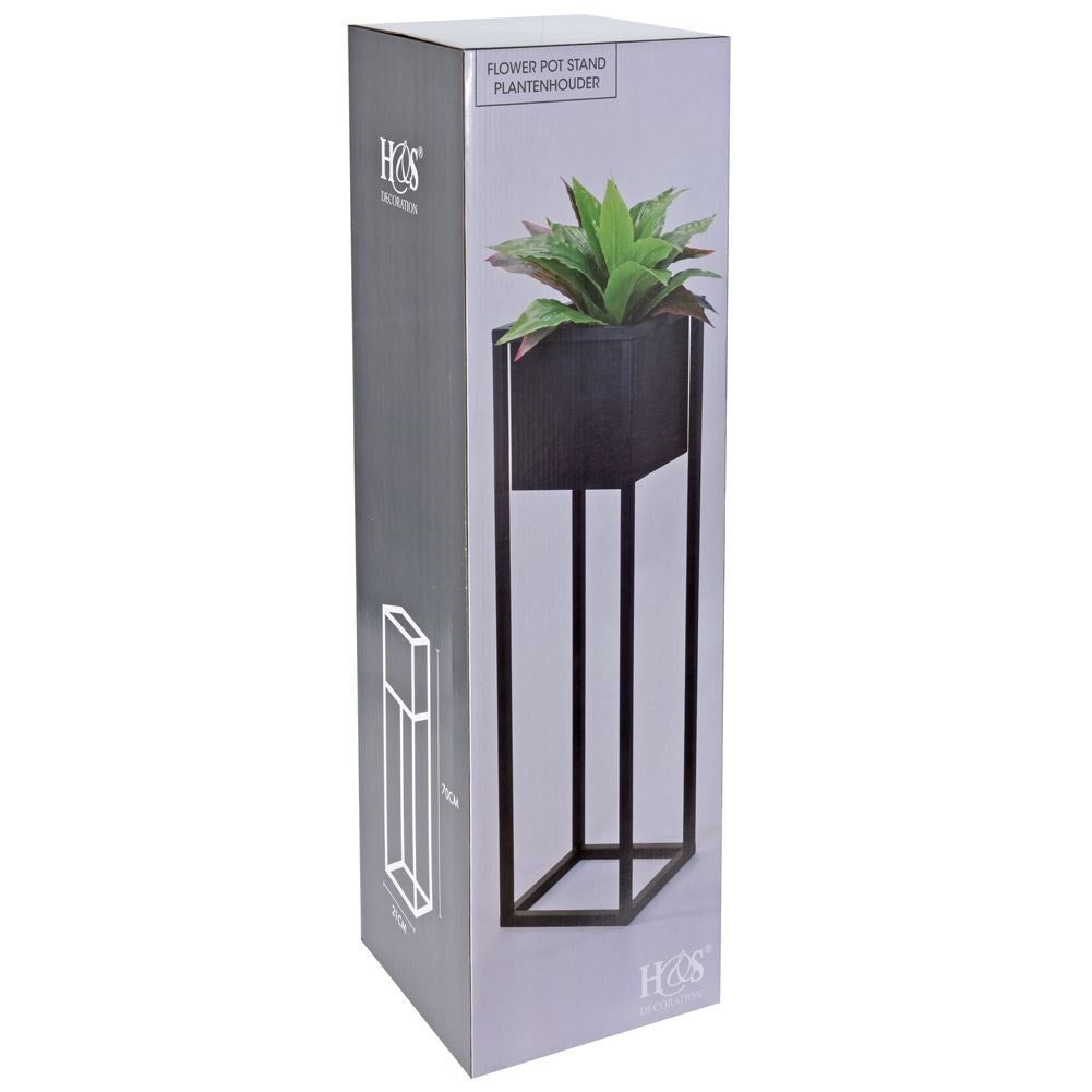 Black metal pot on stand in industrial style