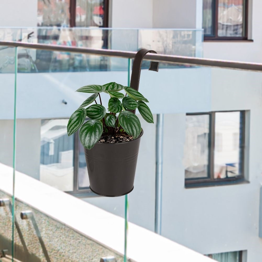 Black metal pot with hanging handle for balcony
