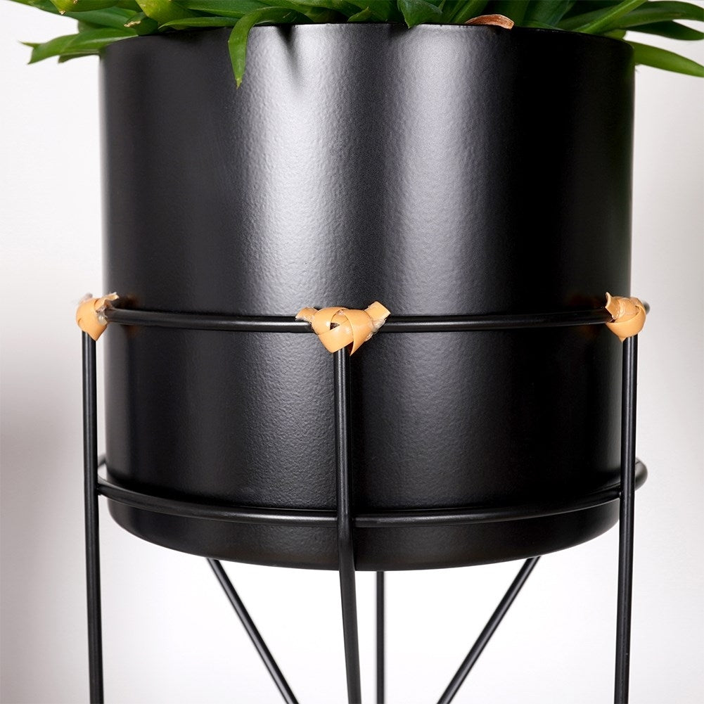 Black metal pot with stand for stylish plant display