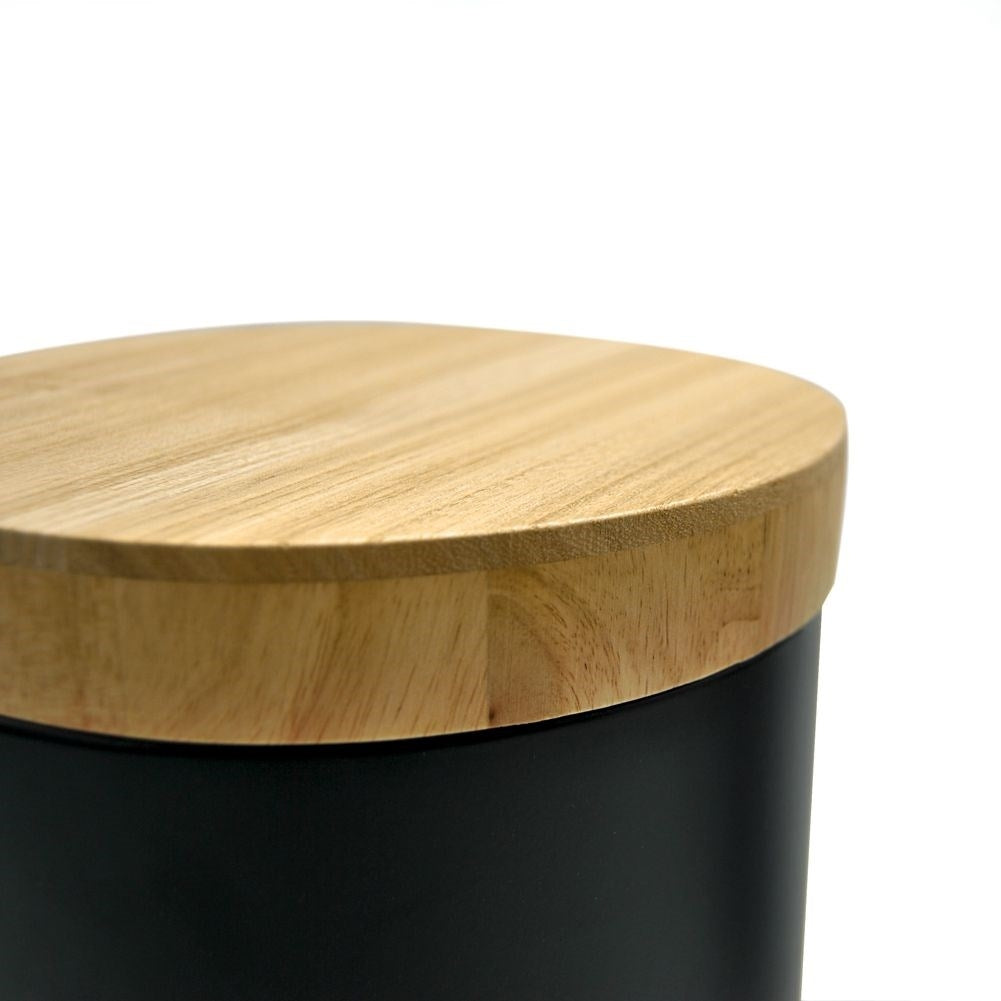 Black metal wastebasket with bamboo lid and pedal opening