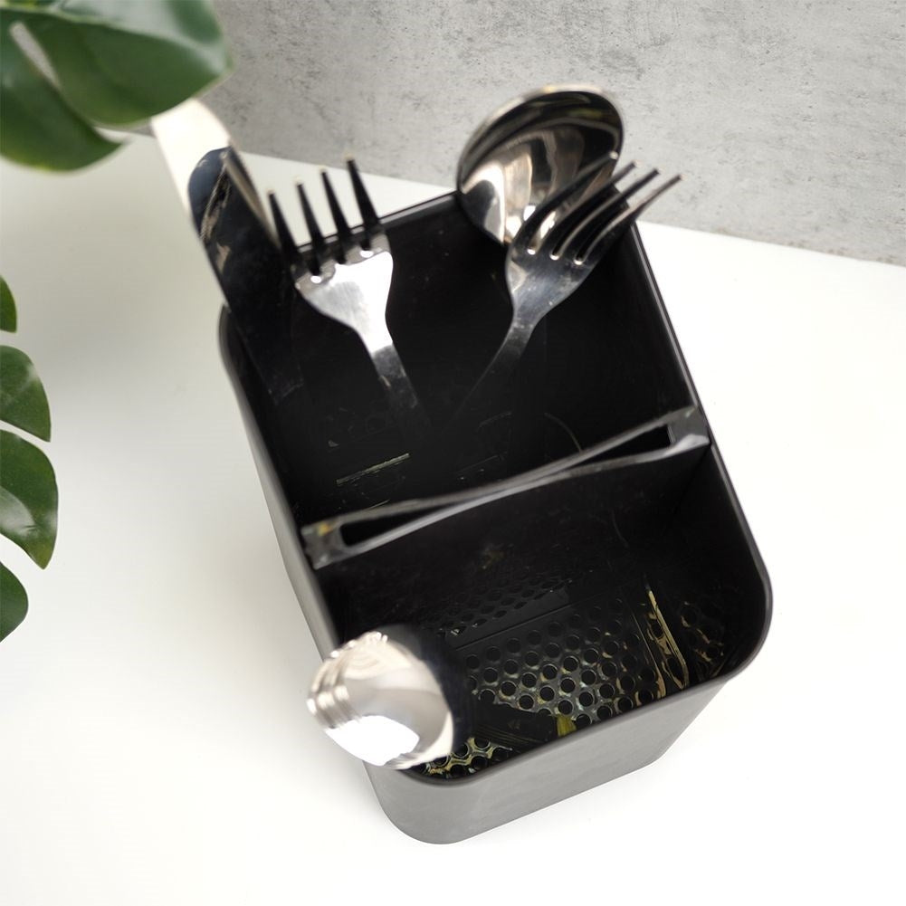 Black plastic container with two compartments for cutlery storage