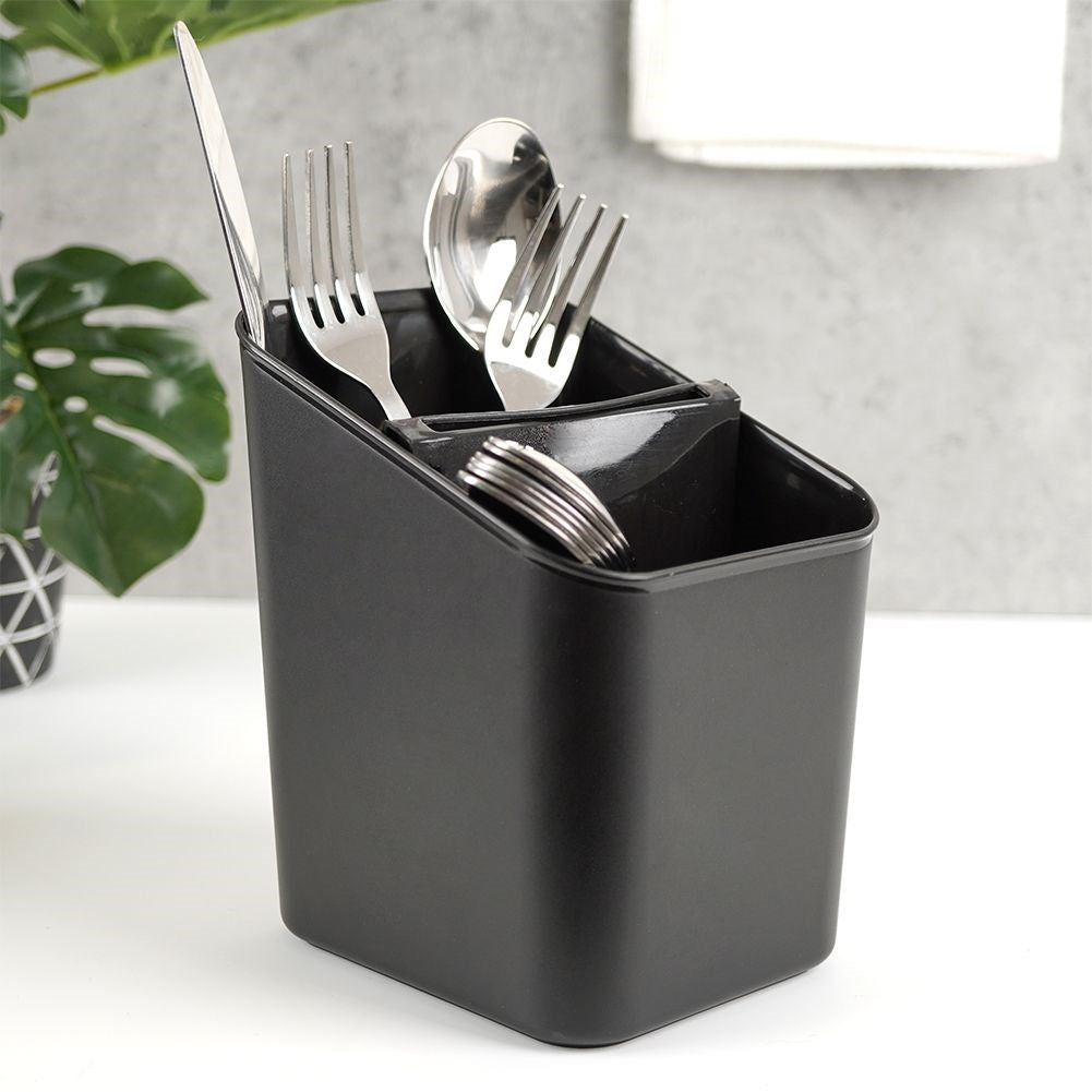 Black plastic container with two compartments for cutlery storage