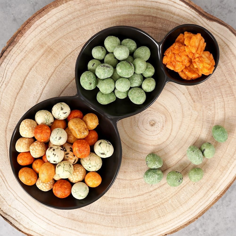 Black porcelain bowl with three compartments for snacks and dipping sauces