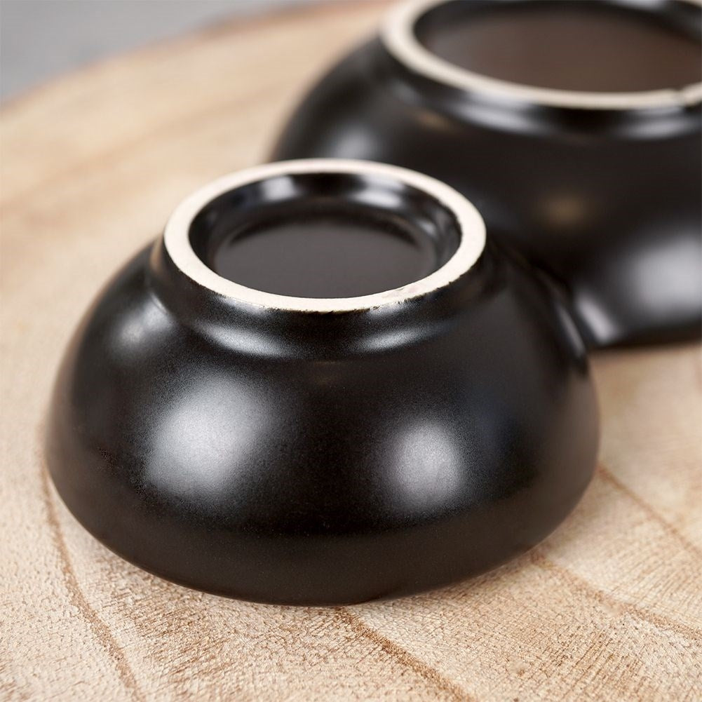 Black porcelain bowl with three compartments for snacks and dipping sauces