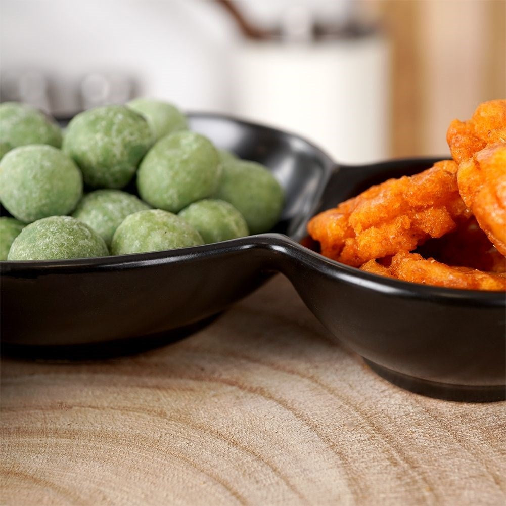 Black porcelain bowl with three compartments for snacks and dipping sauces