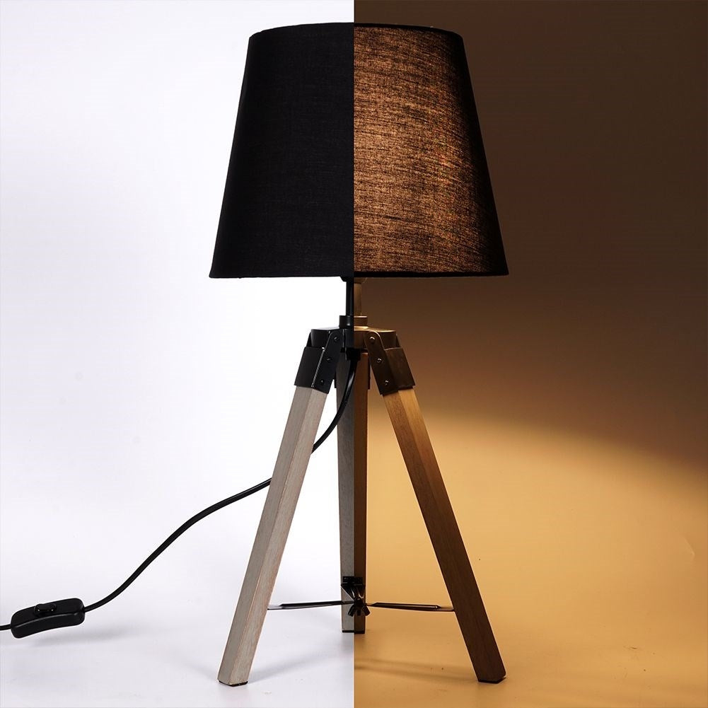 Black table lamp with shade and wooden legs for home and office