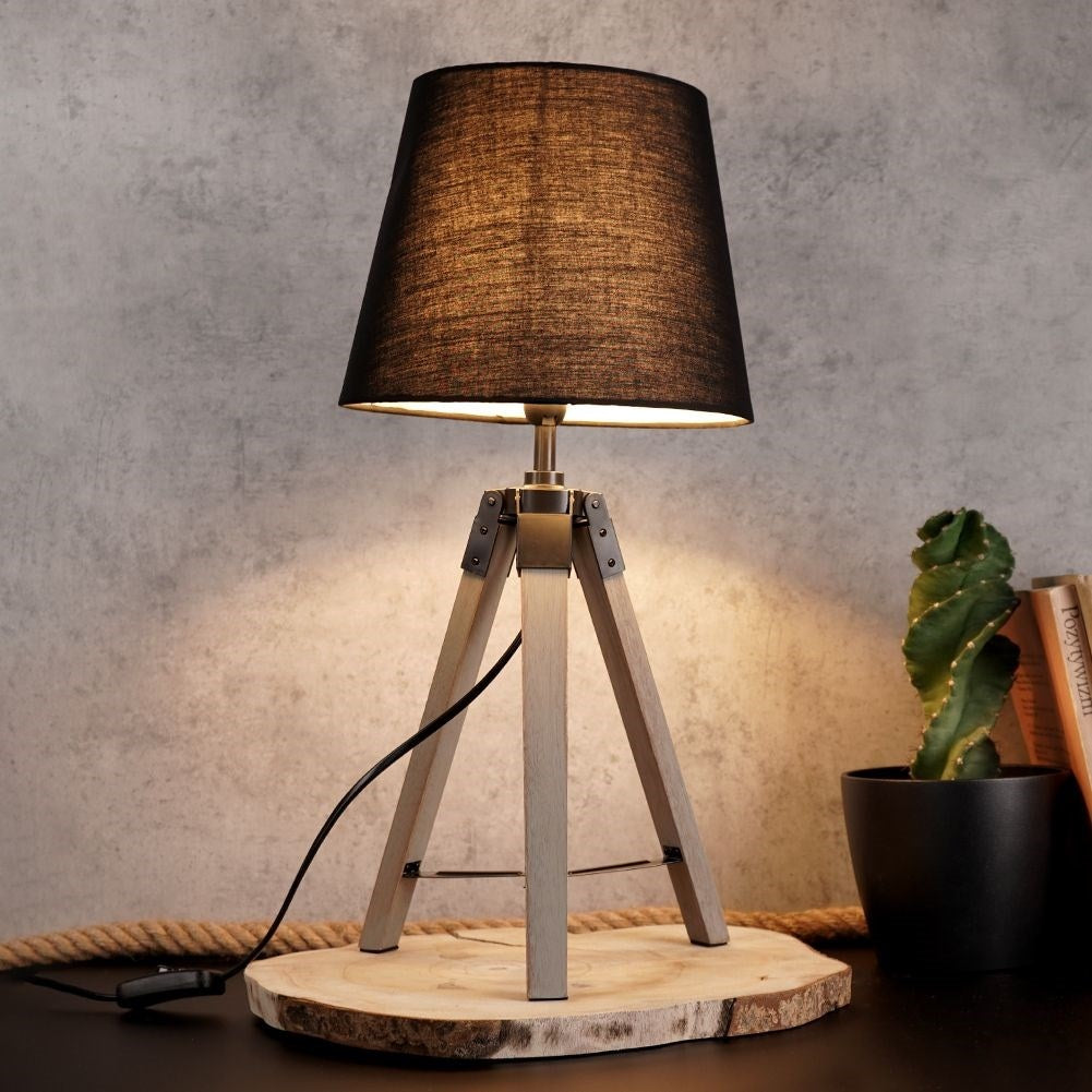 Black table lamp with shade and wooden legs for home and office