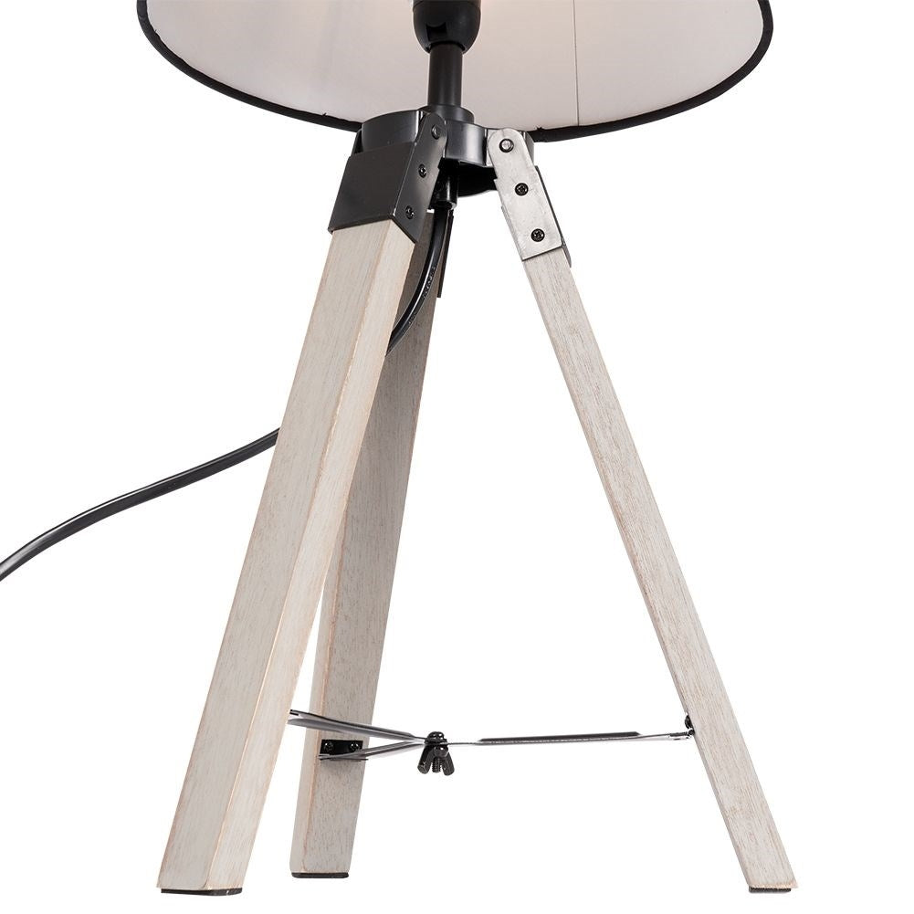 Black table lamp with shade and wooden legs for home and office